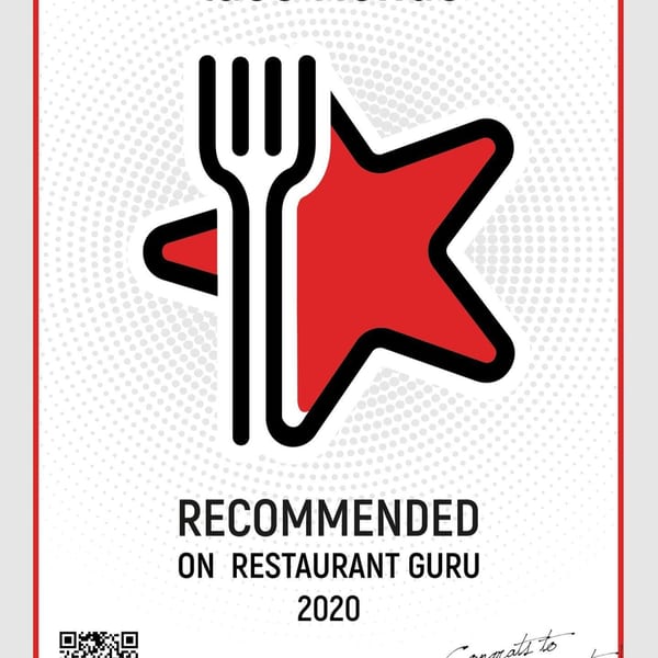 A white certificate with a red star and fork logo, stating "Recommended on Restaurant Guru 2020".